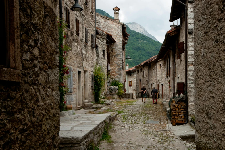 an empty street with some people walking on it