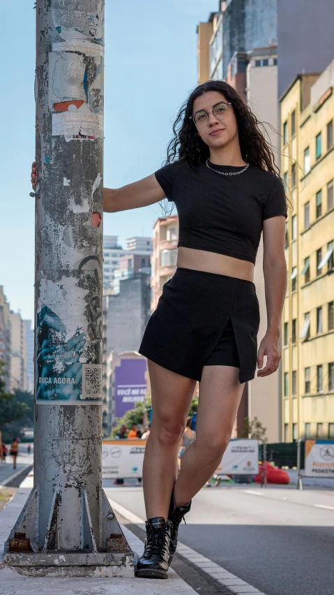 a woman posing for a po on the street