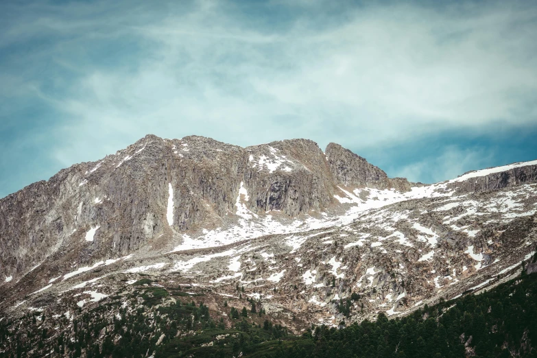 a large mountain is covered with snow on it