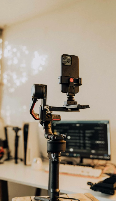 a video camera attached to a tripod