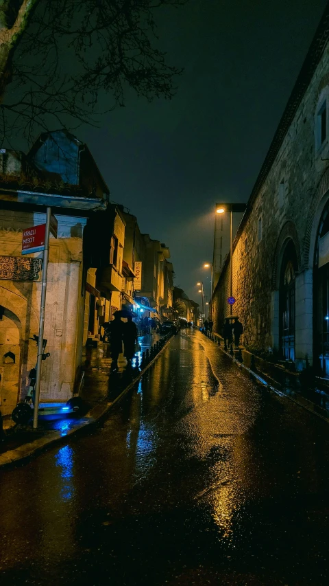 a person with an umbrella is walking on the side walk