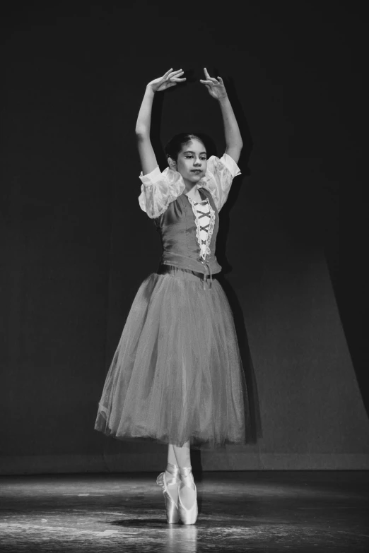 black and white image of girl in tutu skirt