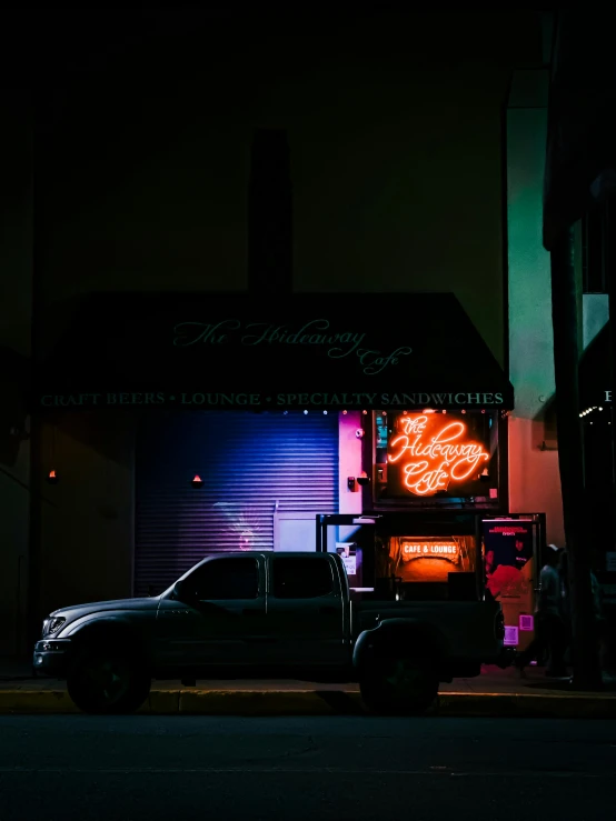 a truck is parked outside at night