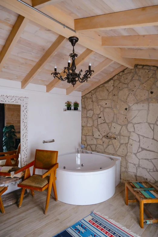 a room that has an unusual and nice looking tub in the middle