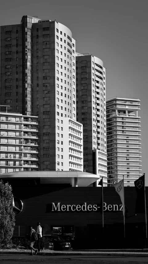 black and white image of a city with tall buildings