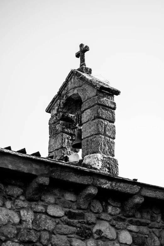 the top of the old brick church building has a cross on it