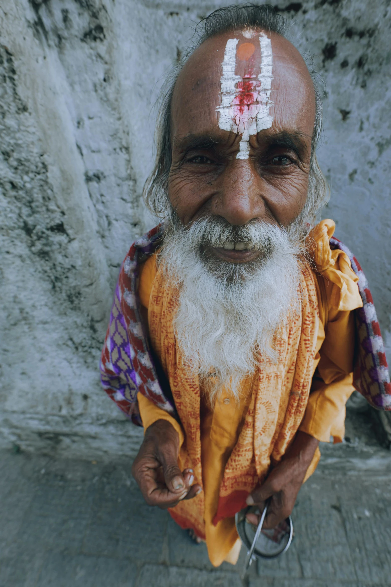 a man with white paint on his face and beard