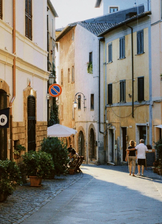 an image of people walking down the street