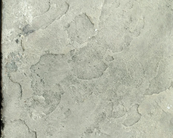 a stone slab with a small amount of small dots of dirt