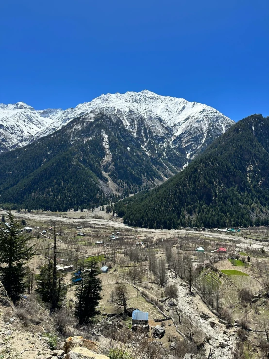 a distant view of a valley with a mountain in the background