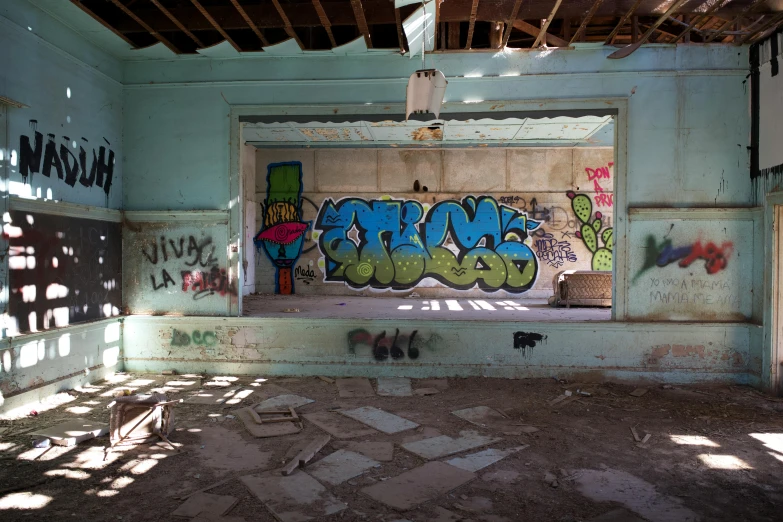 an abandoned room has been painted with graffiti