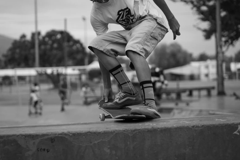 young man riding his skateboard in the park