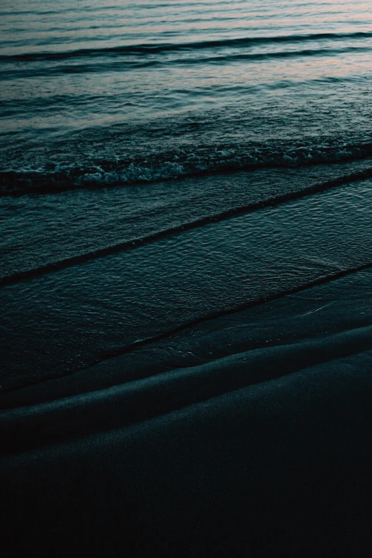 the ocean and beach are just beginning to darken