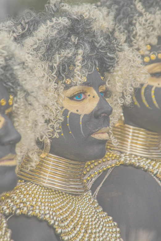 this is a woman with her face painted as queen nea