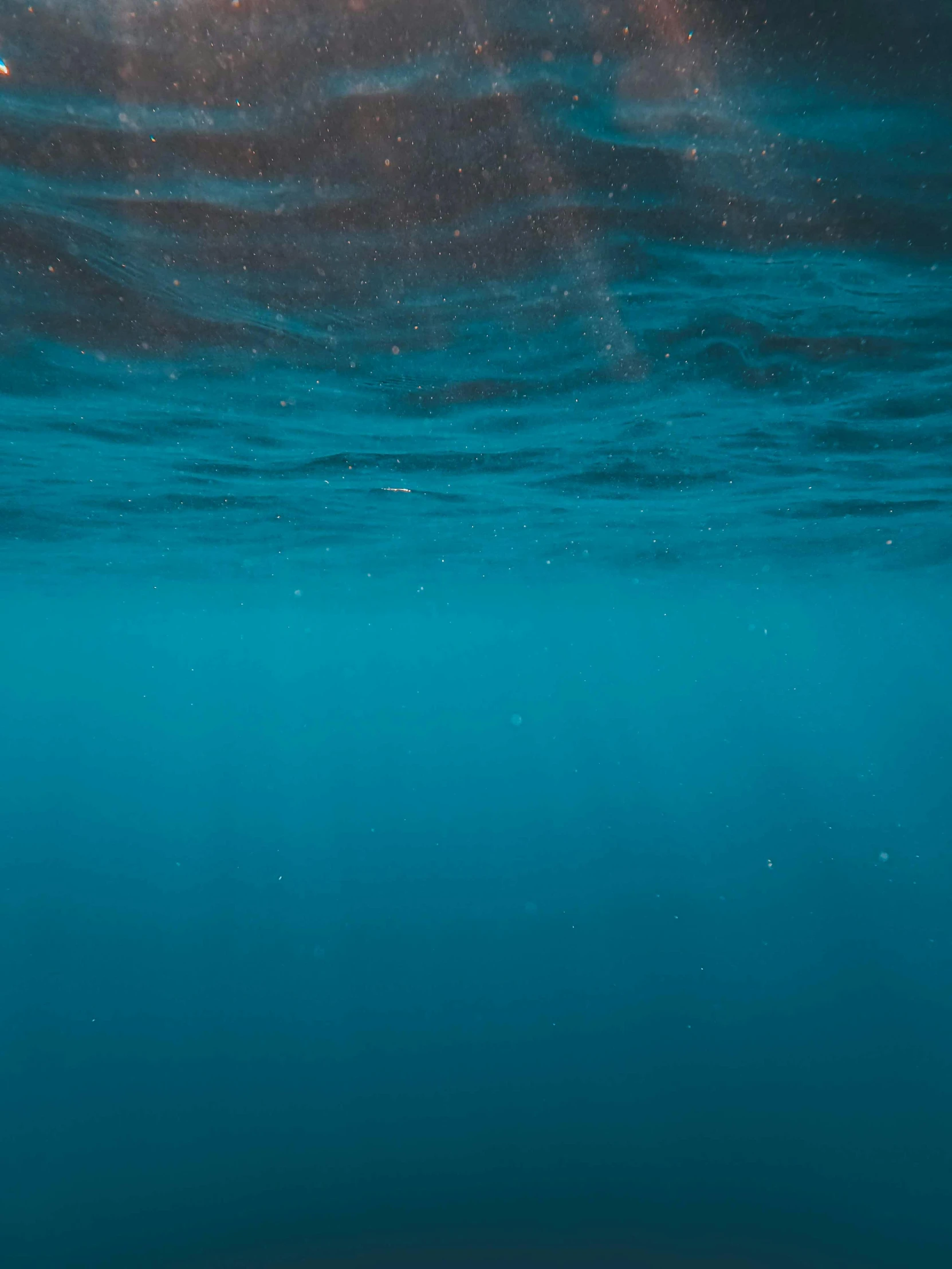 a surf boarder is riding in the water