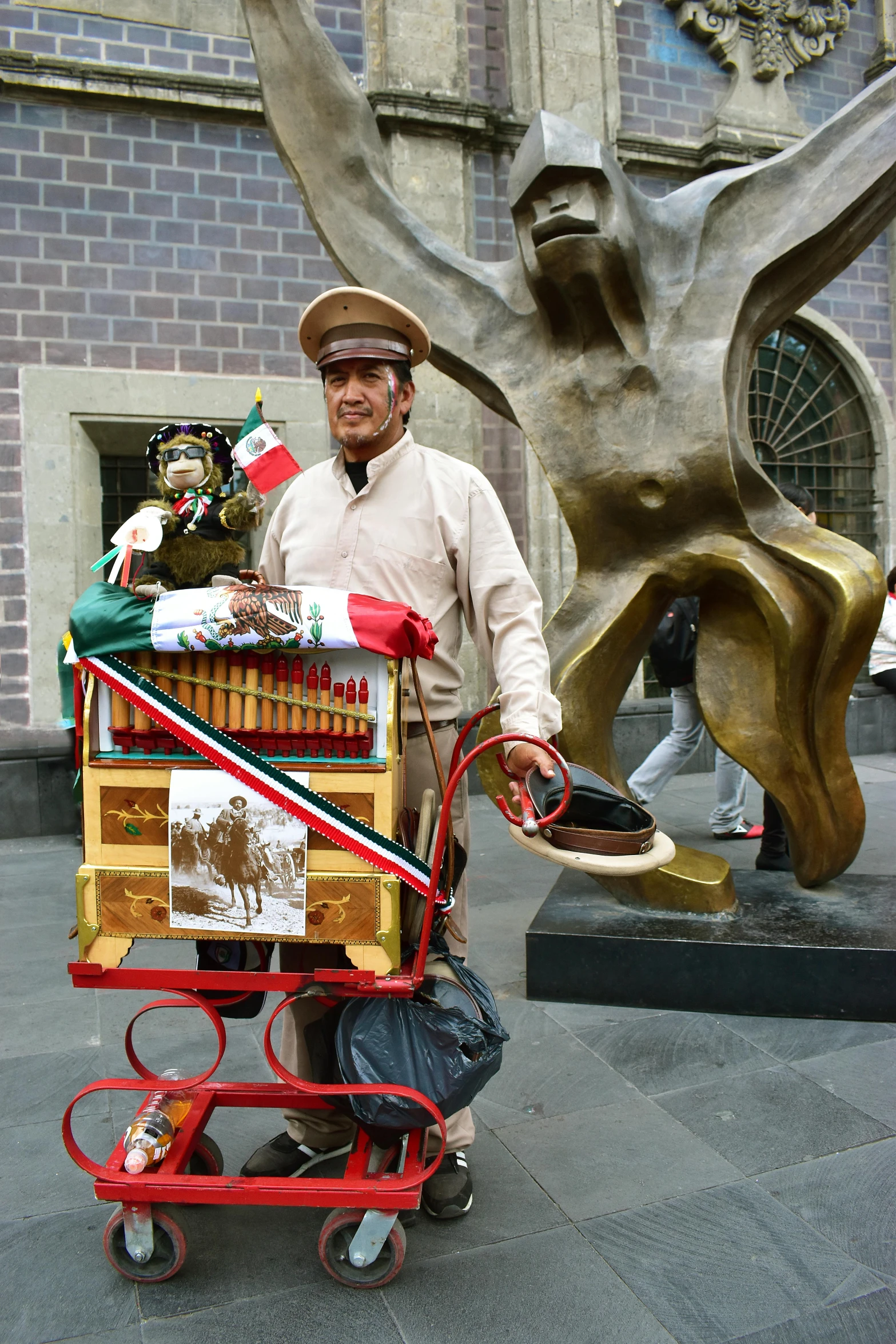 an older man holding a cart full of boxes