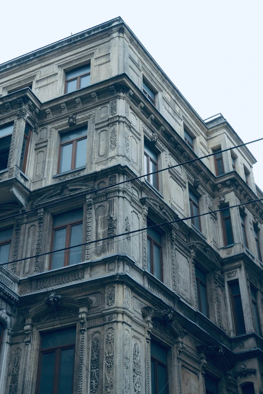 an old building with ornate windows and stucco facade