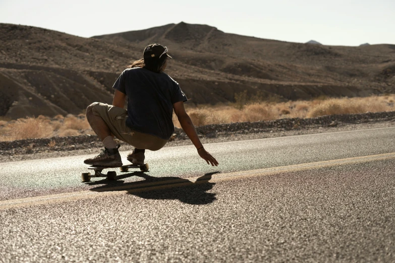 a man on a skateboard in the road