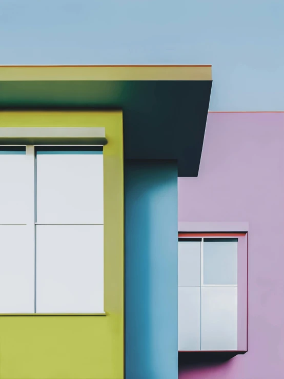 a blue yellow and pink house painted with three windows