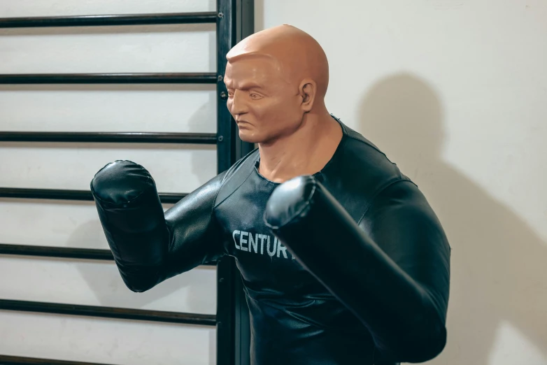 the statue of an boxer is posed with a punching glove