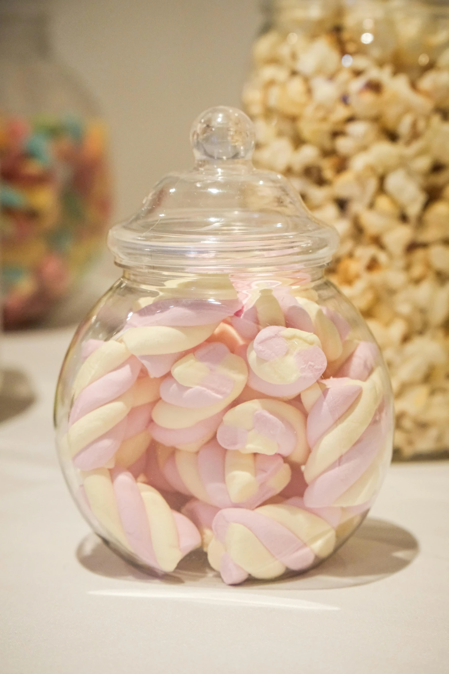 candies in a glass jar on a table