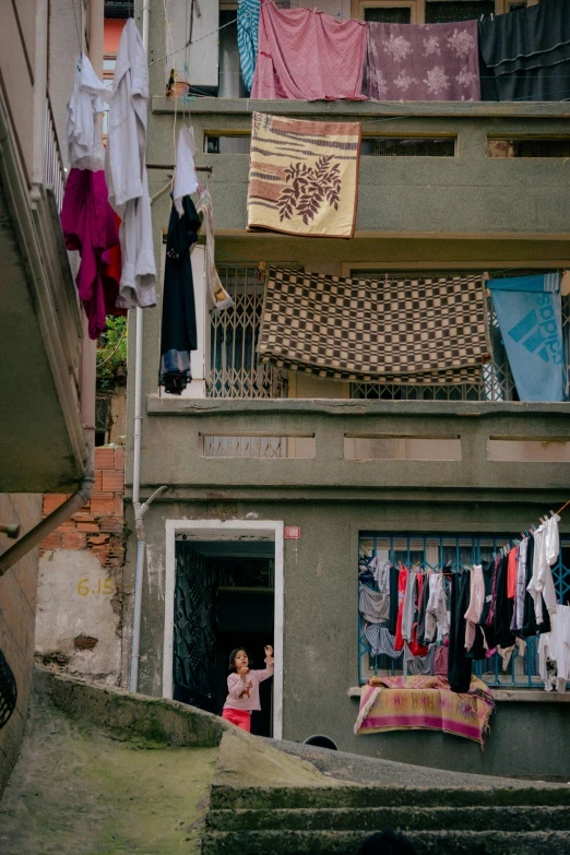 a  hanging clothes from the side of a building