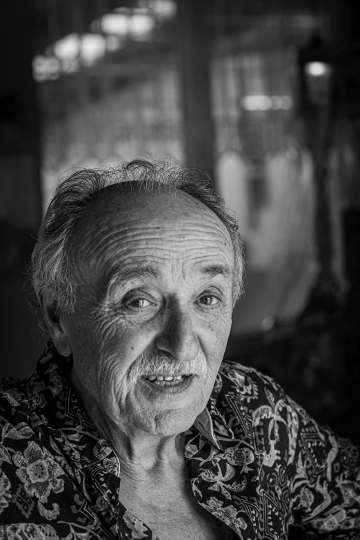 a woman is wearing a shirt and smiling