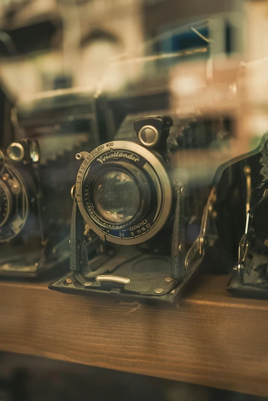 a group of antique cameras are shown on display