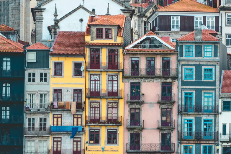 a building on a street corner with lots of windows