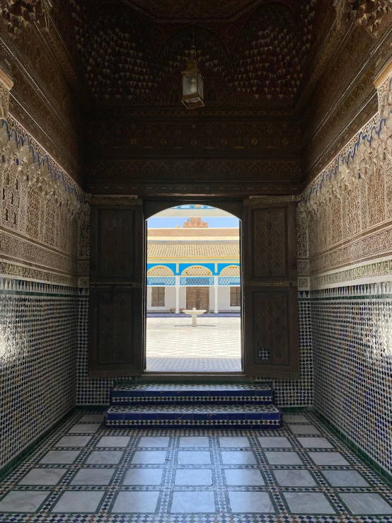 a beautiful walkway in the middle of an ornate building