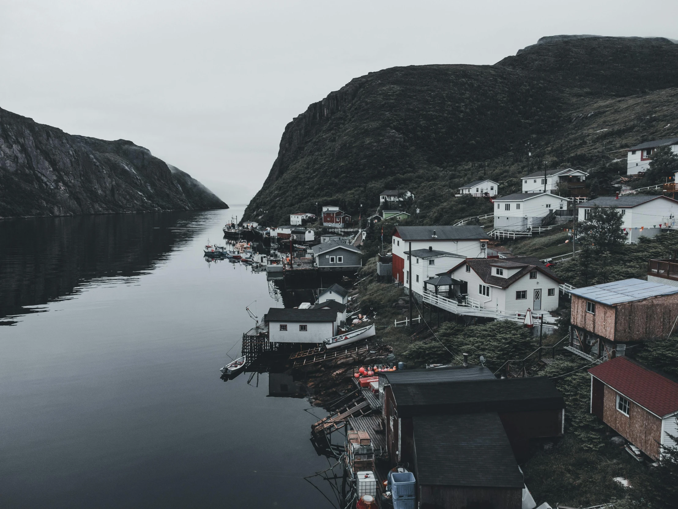 a small group of houses along the water