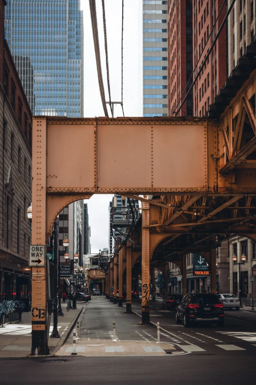 an overpass at an intersection between two buildings