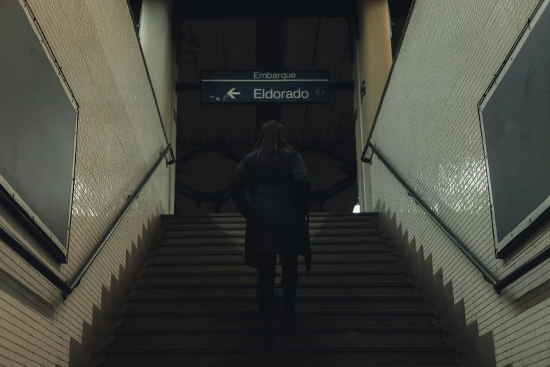 a person ascending some stairs at the end of the flight