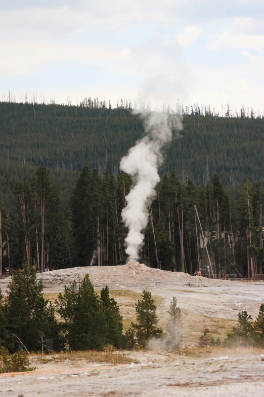 a geoming machine spraying water on an open field