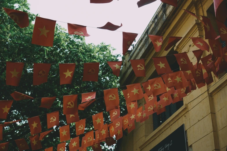 a red string hanging from the top of a building