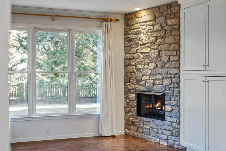 a fireplace sitting in the corner of a living room