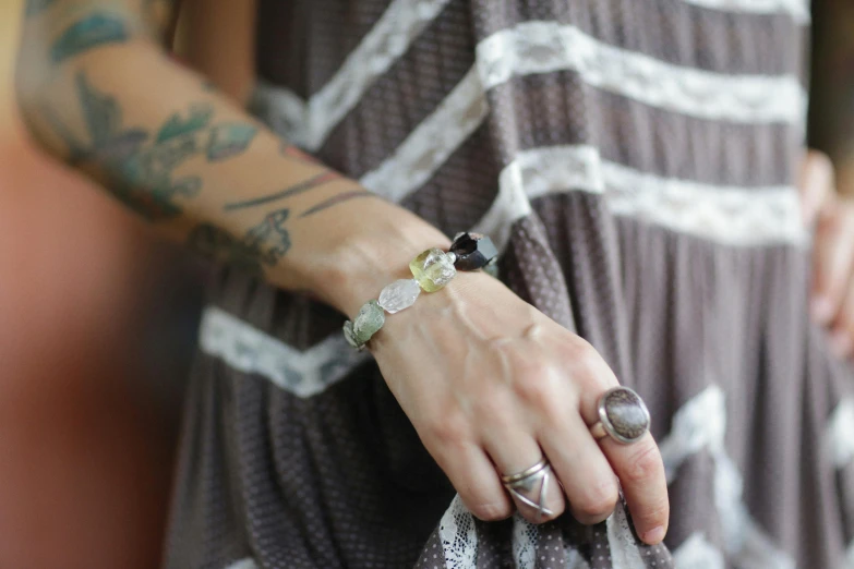 a close up of a person holding a handbag