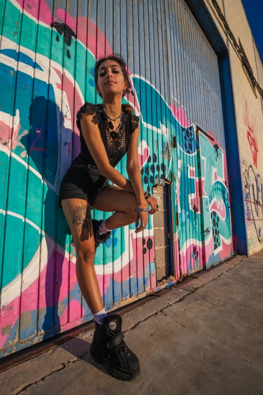 woman sitting on a curb with her legs crossed