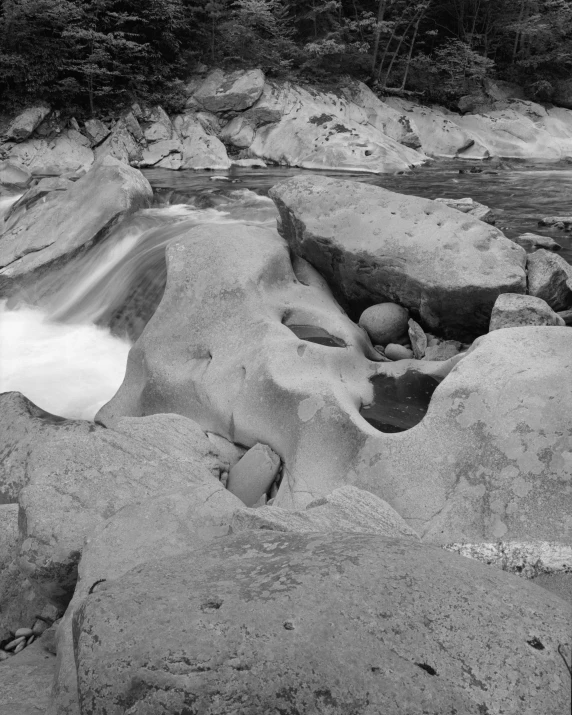 rocks and water that are running by in the river