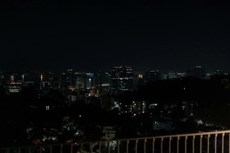 city skyline with buildings at night in the background