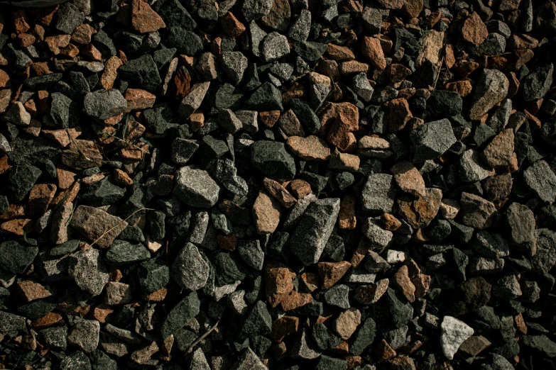 a mixture of rocks and gravel on the ground