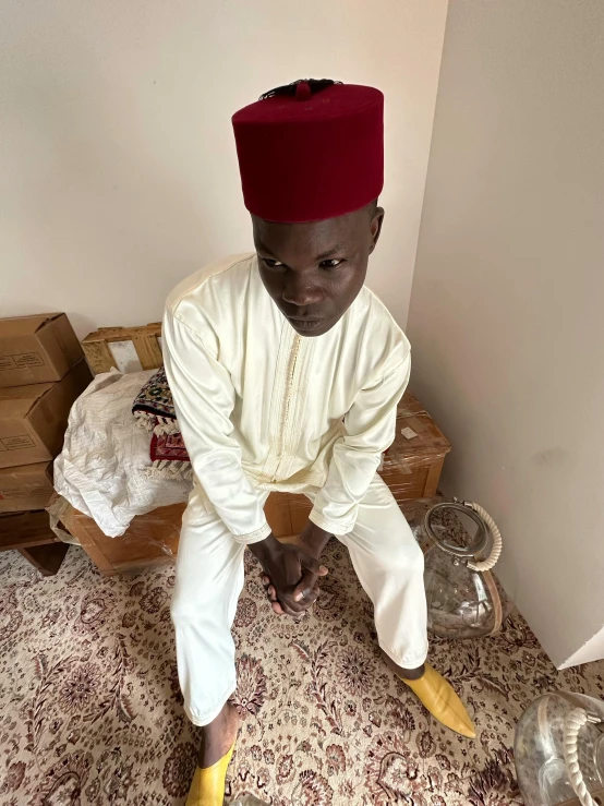 an african american man is posing on the ground