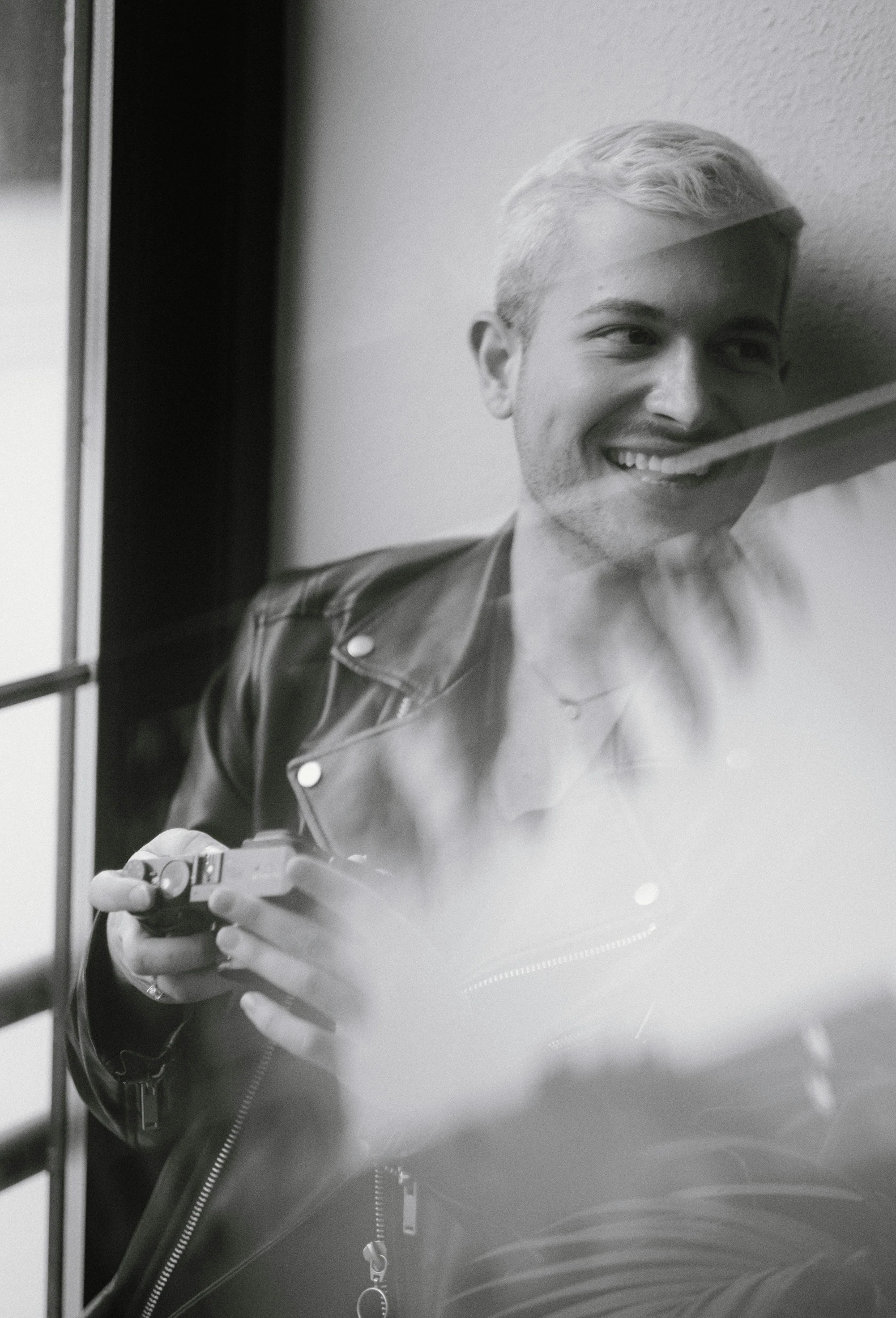 a black and white po of an older man smiling