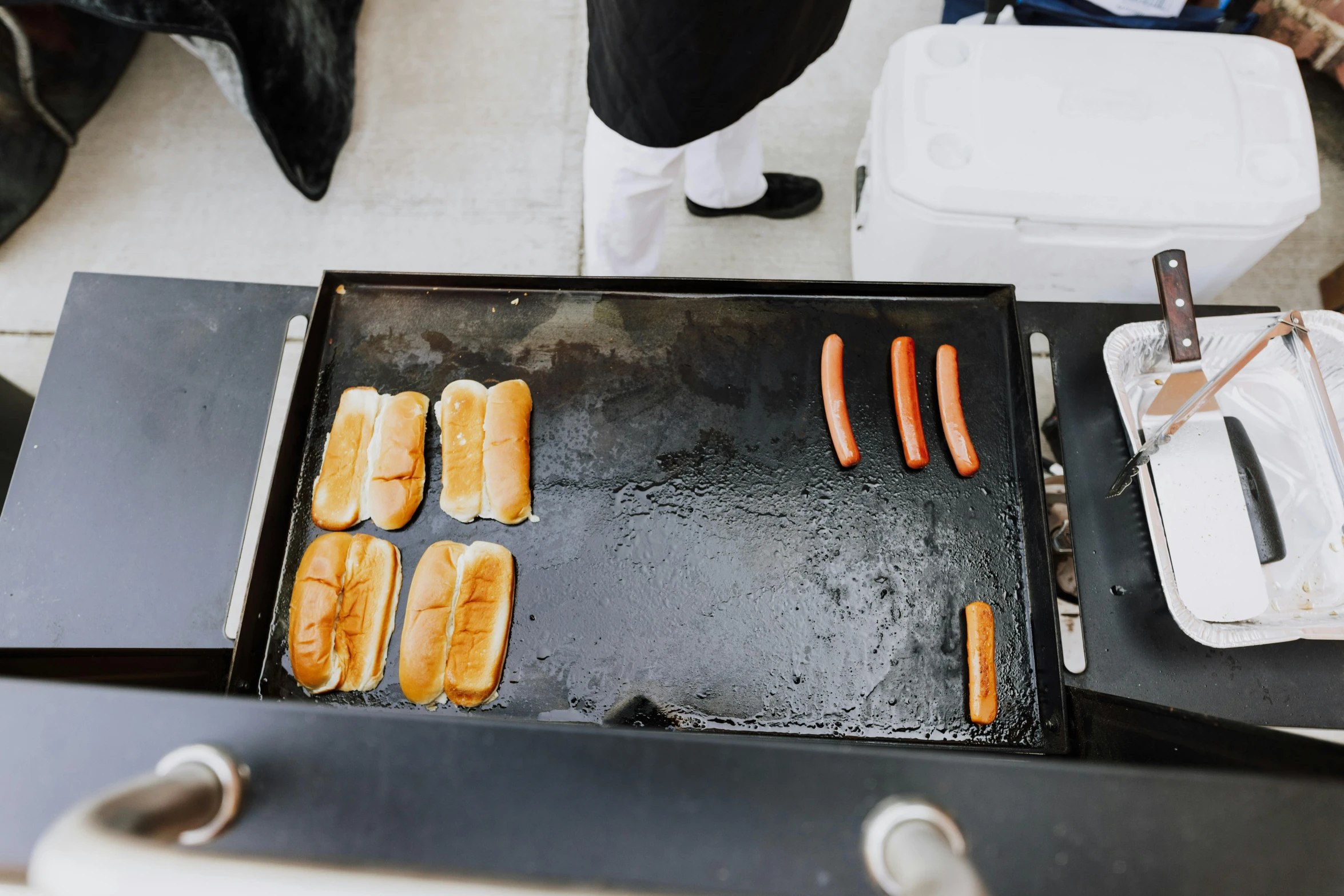 a bunch of  dogs sitting on top of a grill