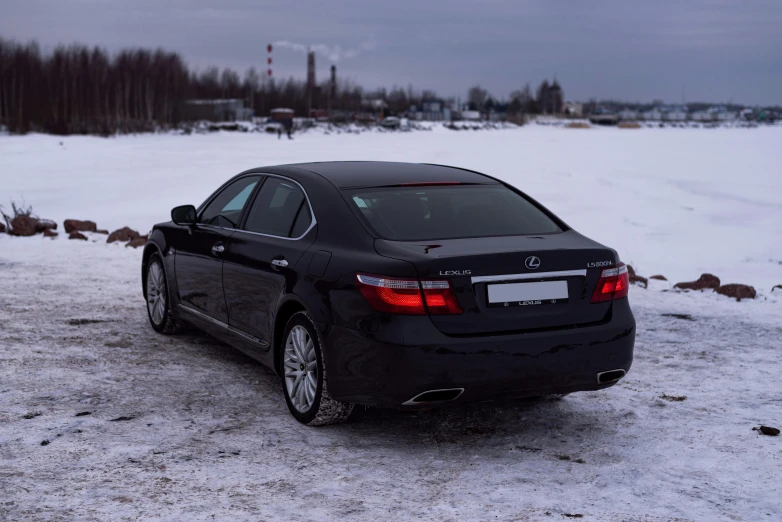 the back end of a car in snow covered field