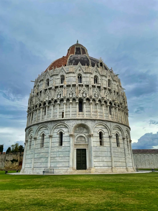 a large, stone structure with a small round tower