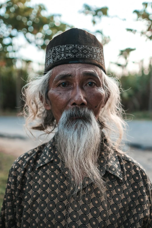 an old man has a big beard and long white hair