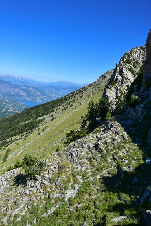 the view of an outside part of mountains from the top of a mountain