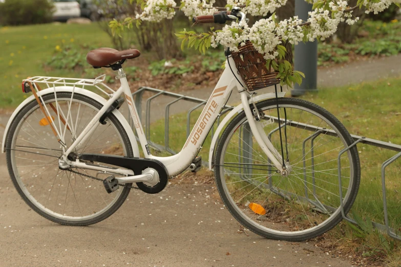 the bike is standing alone in the grass