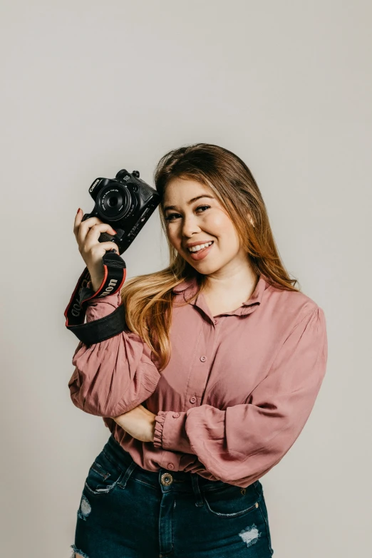 a woman in pink posing for the camera